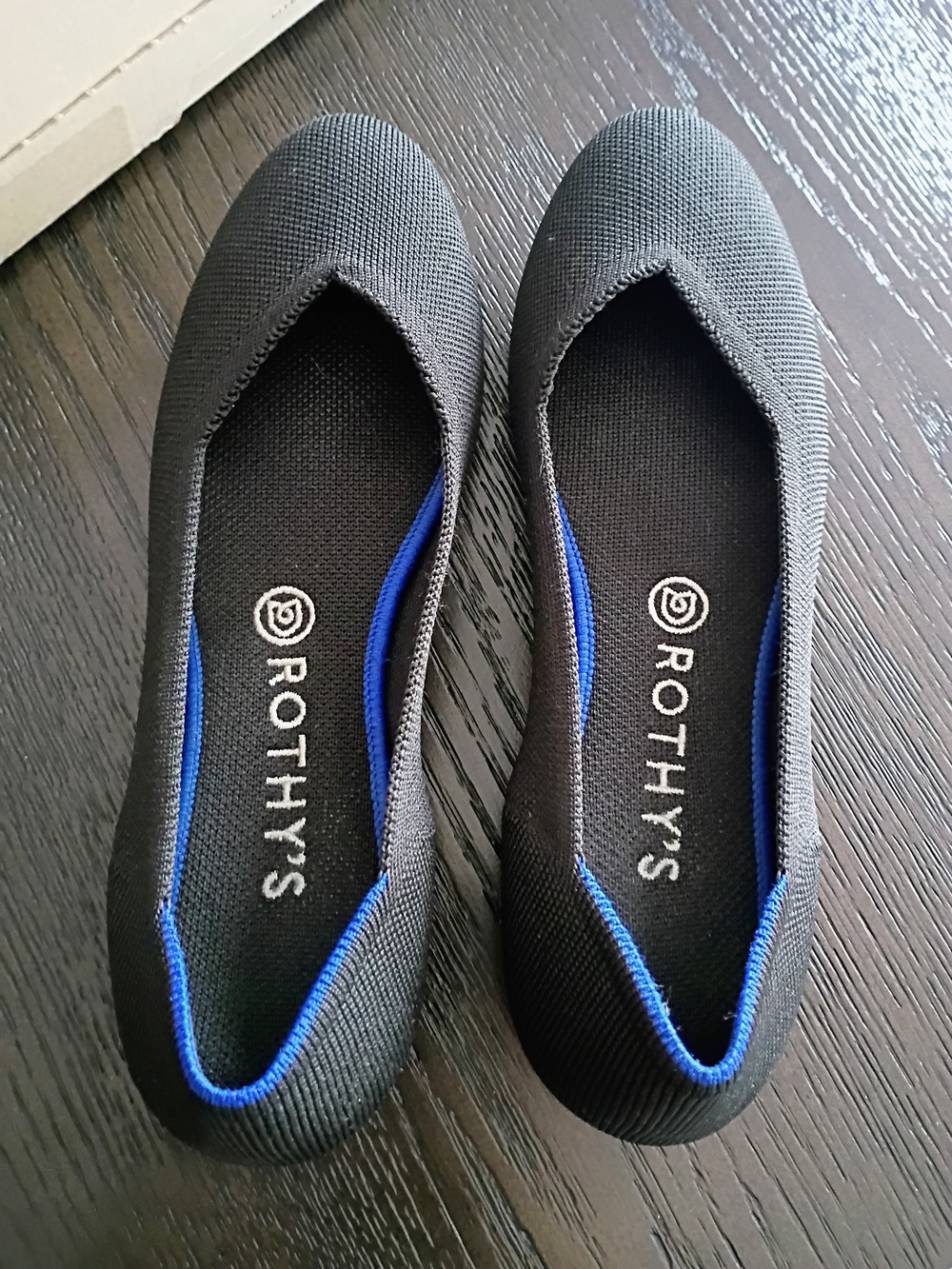 Rothy's Women's Black Slip-On Flats with Blue Trim